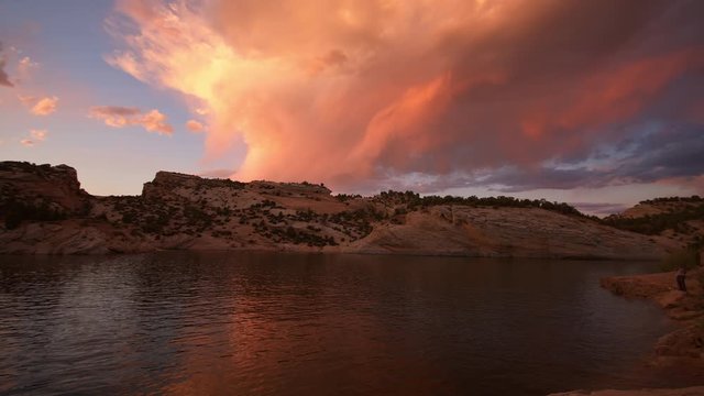 Slow motion pan of colorful sunset reflecting in Red Fleet Reservoir in Utah with Blackmagic 6K camera.