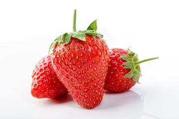 beautiful and ripe red strawberries on a white background