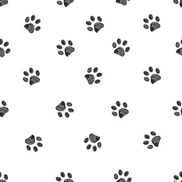 Black doodle paw prints seamless pattern