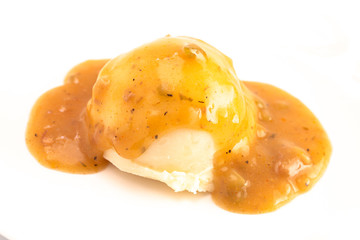 Scoop of Mashed Potatoes with Brown Meat Gravy on Top