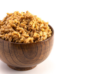 Cajun Dirty Rice in a Wooden Bowl on a White Background