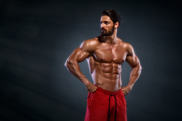 Fototapeta na wymiar Handsome Muscular Men Posing and Flexing Muscles