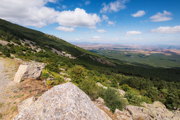 Fototapeta na wymiar View of green valleys of Aragon region from the moncayo mountain. Natural environment in summer season .