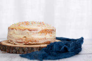 Vanilla Birthday Cake with Colorful Sprinkles on Top