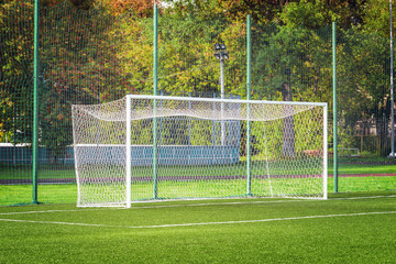 View of the football gate by the green grass field.
