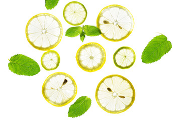 Bright light through slices of lemon, lime and mint leaves