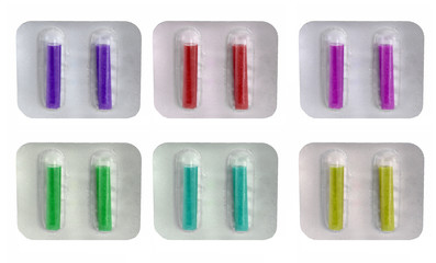 Colorful pills in blister on white background. Pharmaceutical drugs for use as medications. Incense sticks for vacuum cleaner.