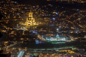 Night view of Tbilisi with Sameba (Trinity) Church and other landmarks. Travel.