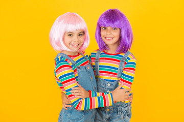 Cheerful friends in colorful wigs. Anime cosplay party concept. Anime fan. Animation style characterized colorful graphics vibrant characters fantastical themes. Anime convention. Happy little girls