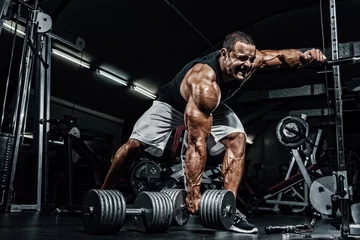 Foto op Plexiglas Hard Core Bodybuilding. Bodybuilder ready to lift heavy dumbbell © mrbigphoto