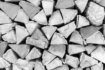 Background, texture of the wall from the folded logs. Black and white. High contrast.