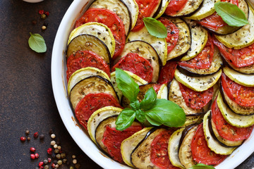 Ratatouille - a traditional vegetable dish of French cuisine. Ratatouille dish of eggplant, zucchini and tomatoes.