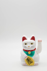 white fotune cat on isolated white background with copy space