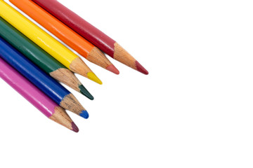 Rainbow colored pencils against white background.