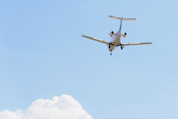Passenger airplane landing in the airport runway. Passenger plane and blue sky with clouds. Details of airplane landing .