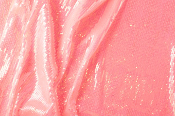 Large shiny glossy pink sequins background.