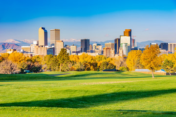 Scenic of Denver Colorado skyline. City Park, Ferril Lake and Rocky Mountains. Located in Denver, Colorado, USA. - obrazy, fototapety, plakaty