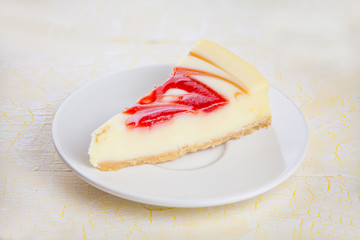 delicious cheesecake with strawberries on  plate