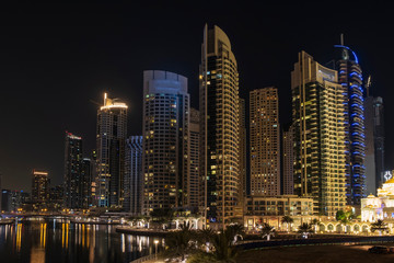 Fototapeta na wymiar View of Dubai Marina by night in long exposure, UAE. May 2019