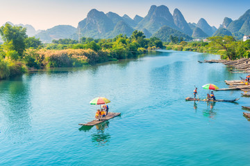 Landscape of Guilin. Tourists are visiting by Bamboo raft. Located near Yangshuo, Guilin, Guangxi, China.