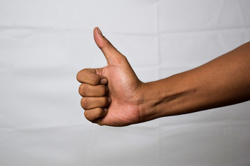 Close up Asian man shows hand gestures it means OK isolated on white background