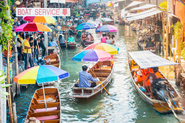 Damnoen Saduak Floating Market, tourists visiting by boat, located in Bangkok, Thailand. - obrazy, fototapety, plakaty