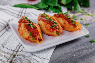 Shells pasta stuffed with a ricotta cheese and meat.
