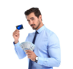 Handsome businessman with dollars and credit card on white background