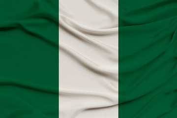 national flag of nigeria on silk fabric with soft folds, background