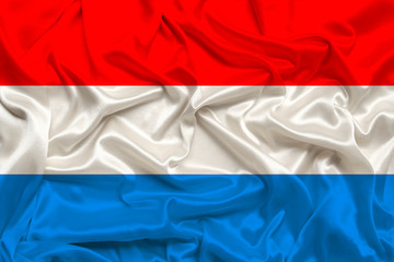 national flag of the Luxembourg on gentle silk with wind folds, travel concept, immigration, politics