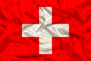 national flag of switzerland on delicate silk with wind folds, travel concept, immigration, politics