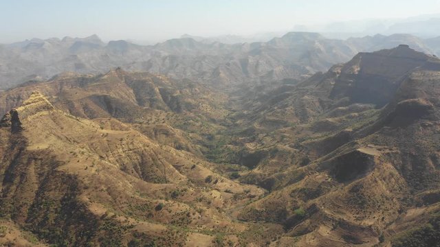 Retreating drone flight over rugged mountain valley in Simien national park in Ethiopia