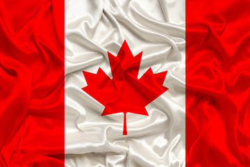 Canada national flag on gentle silk with wind folds, travel concept, immigration, politics