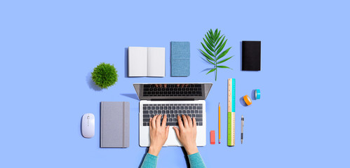 Person using a laptop computer from above