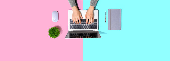 Person using a laptop computer from above