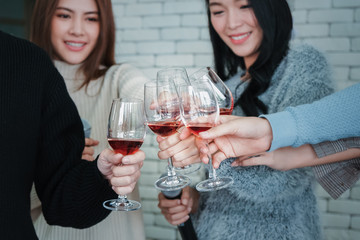 group of asian friends enjoy having party and drinking wine together
