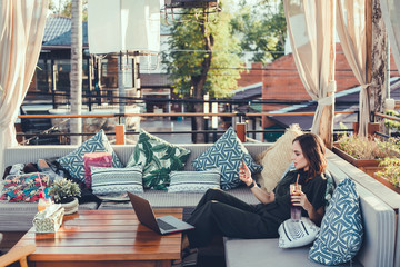 Pretty Young Beauty Woman Using Laptop in cafe, outdoor portrait business woman, hipster style,...