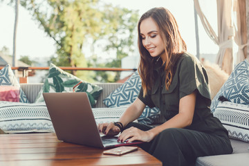 Pretty Young Beauty Woman Using Laptop in cafe, outdoor portrait business woman, hipster style,...