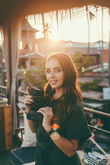 Beauty brunette woman posing in the street, make photo, using photo camera, outdoor hipster portrait, photographer, Thailand, sunglasses, photographer, travel blogger, watch, cafe, happy face, smile