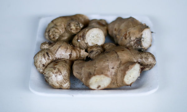 Ginger or Zingiber officinale on white background. Used as a spice and a folk medicine.