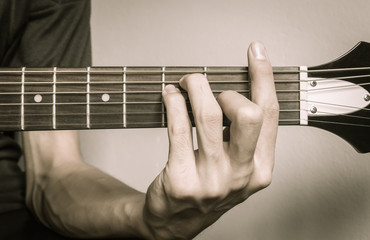 Guitar Player Hand in F Major Chord on Acoustic Guitar in Vintage Tone