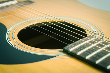 Obraz premium Sound Hole and Acoustic Guitar String in Crosswise View in Vintage Tone
