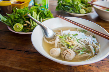 Close up of Pho noodle soup in restaurant in Luang Prabang, Laos. Pho is traditional Vietnamese noodle soup, now is popular food widespread around the world.