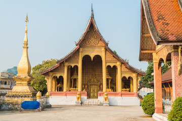 Fototapeta na wymiar Beautiful Buddhist buildings of Wat Sensoukaram in Luang Prabang, Laos.