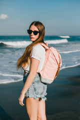 Woman street photo portrait, backpack travel girl,Pretty woman posing in the park, using backpack, travel vibes, hipster girl, outdoor close up portrait, happy face, smile