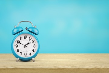 Retro alarm clock on table  background
