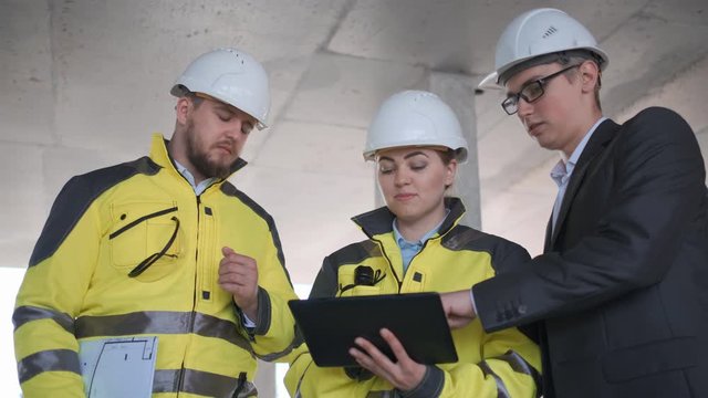 Architect or engineer working, browsing building project indoor of construction site with blueprint plan. businessman worker, man male construction engineers or architects working people. Engineer In