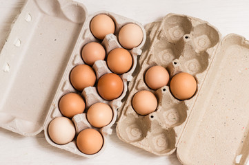 Beige chicken eggs in a carton. Vegetarian natural eco products. Food Gradient