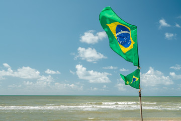 Beautiful Brazilian National Flag Waving in a blue sky day.