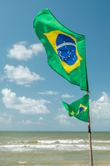 Beautiful Brazilian National Flag Waving in a blue sky day.